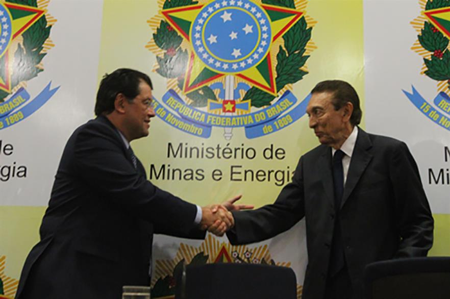 Brazil's new energy minister Eduardo Braga, left, takes over from Edison Lobao, right