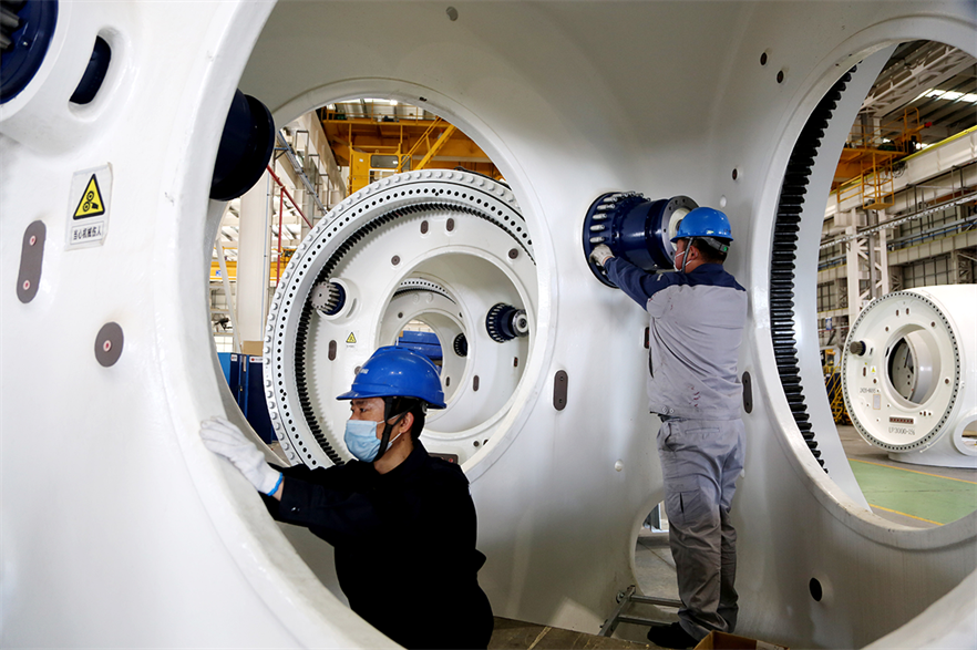 Chinese manufacturers and developers have emerged from 2021 bigger and more competitive, according to Wood Mackenzie (pic credit: Wang Chun/VCG via Getty Images)
