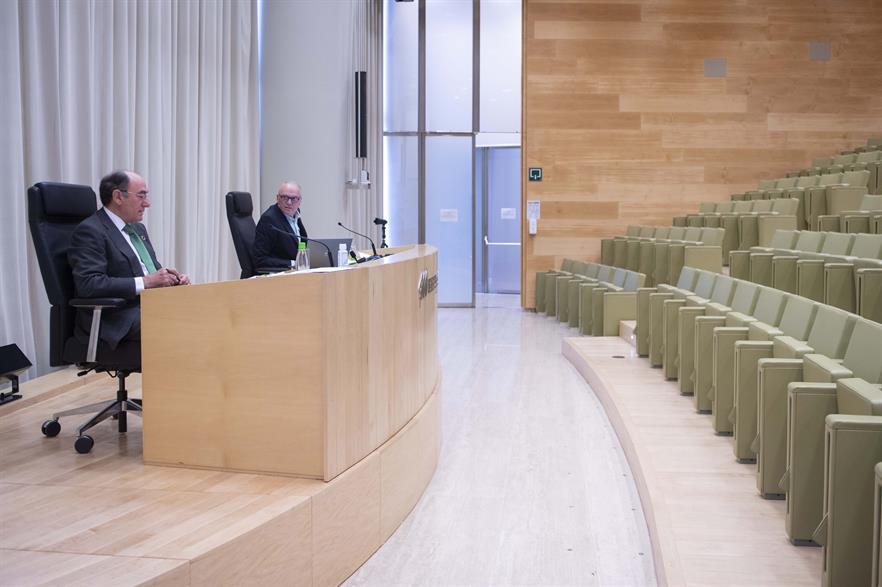 Galán and Martinez-Simancas address an empty conference room