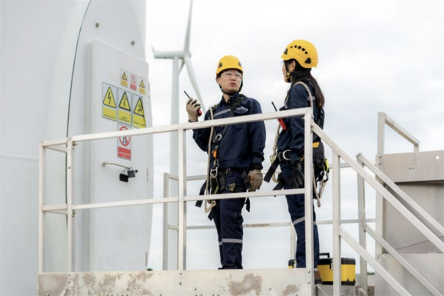 Wind power workers in Thailand (pic credit: Prasit Rodphan/shutterstock)