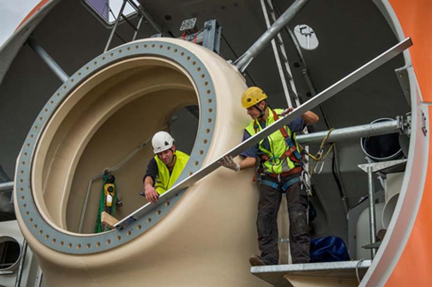 Workers installing Prokon's 3MW prototype turbine