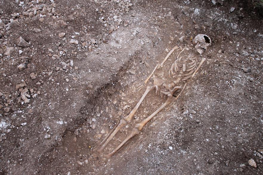 The skeleton was laid to rest facing upwards with his arms at his side, in a grave cut into chalk bedrock (pic credit: E.on)