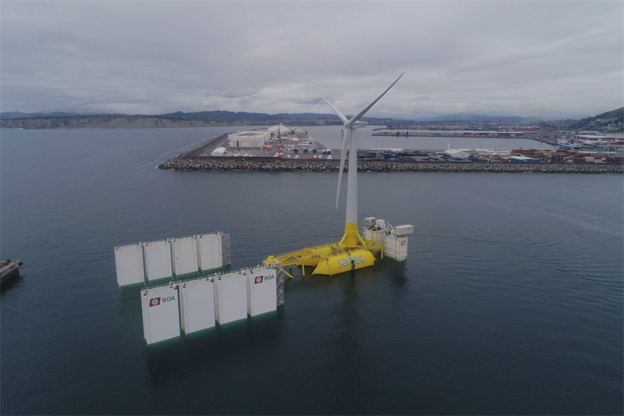 Saitec's DemoSATH platform is towed out to sea by a semi-submersible barge