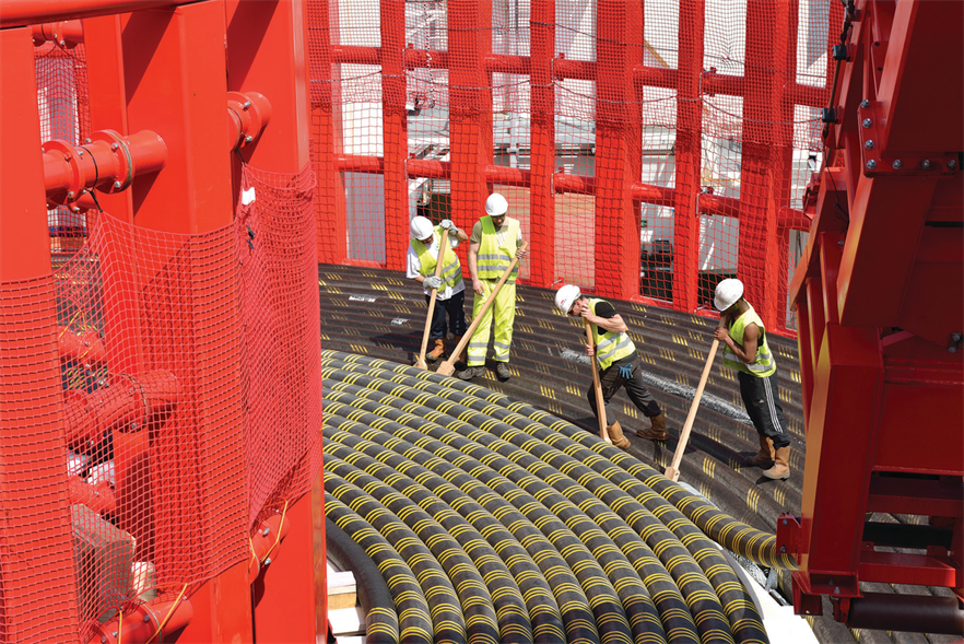 An NKT high-voltage export submarine cable is loaded onto a laying vessel (Image credit: NKT)