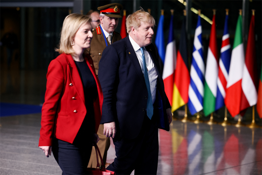 Former UK prime ministers Liz Truss and Boris Johnson have backed a move to ease restrictions on onshore wind development (pic credit: Henry Nicholls/Getty Images)