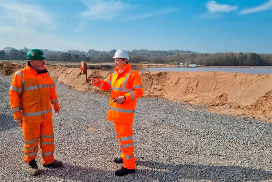 Steve Williams, quarry manager, discusses conservation work at Crown Farm quarry with Edward Timpson, MP. Photograph: Tarmac