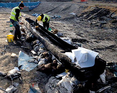 Log boats found at the site are so well preserved that the wood grain and colour can be seen (credit: Cambridge Archaeology Unit)