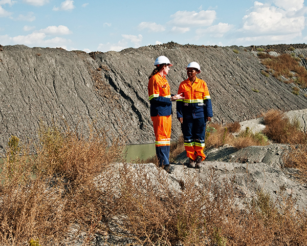 De Beers geologist Evelyn Mervine and Zandile Miya standing on top of fine kimberlite tailings. Photograph: De Beers Group