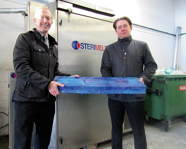 Aneurin Bevan University Health Board’s Peter White (left) and Chris Davies with briquette. Photograph: Welsh government