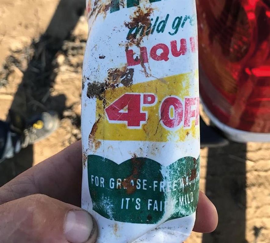 A 47-year-old plastic bottle found on a beach. Photo: Burnham Coastguard Rescue Team/Facebook