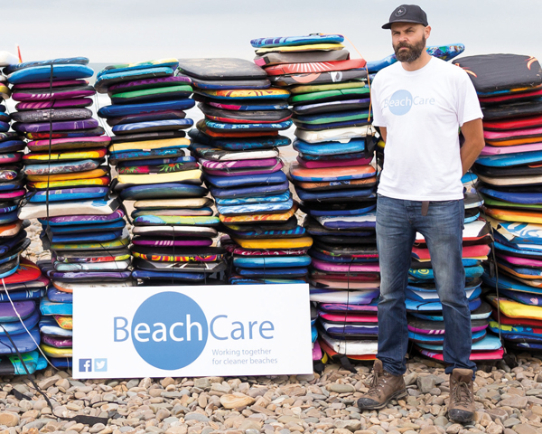 Neil Hembrow with discarded surf boards. Photograph: Keep Britain Tidy