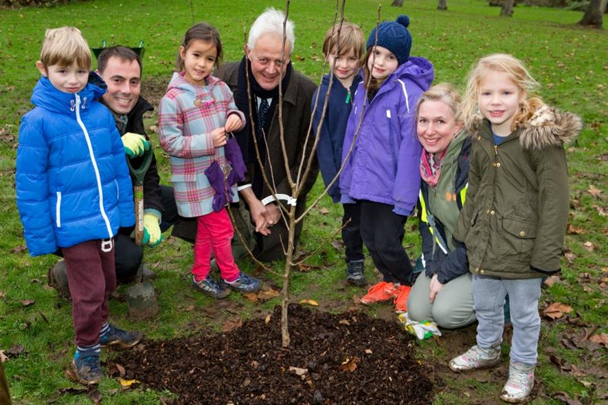 (Adults l - r) Matthew O'Conner, Duncan Wilson and Amber Alferoff of the London Orchard Project with children from Muswell Hill Primary. Picture: HW