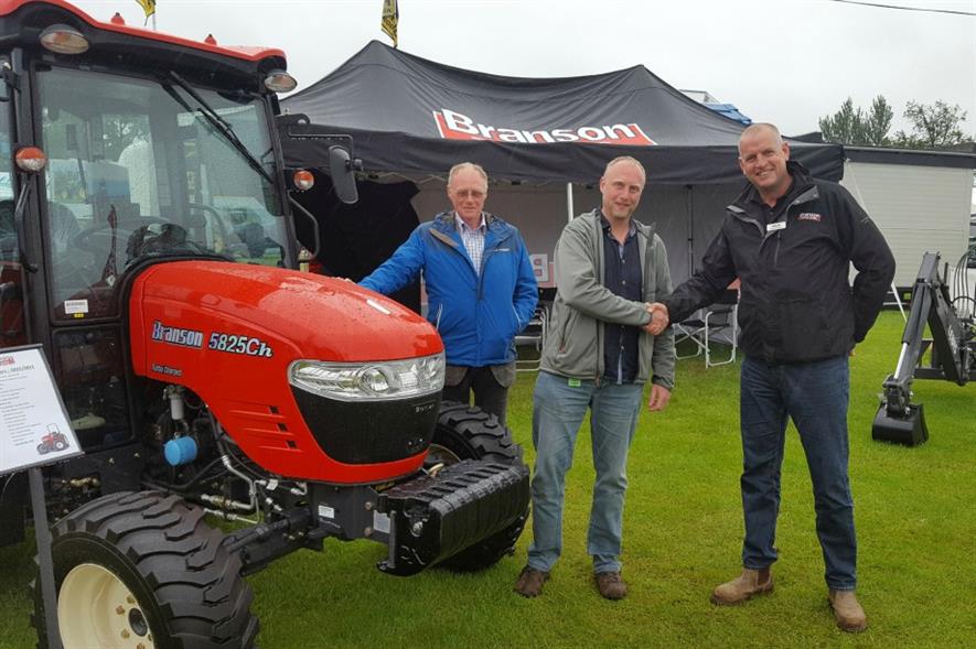 L-R Robin and Chris Moir of Agri-Services with Branson Tractors UK sales manager Stuart Winwood. Image: Supplied