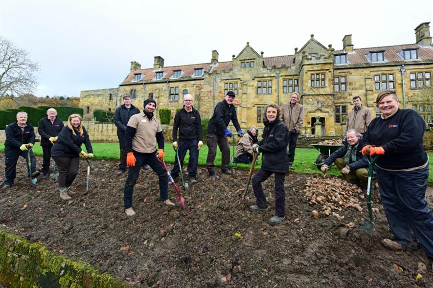 Volunteers planting bulbs at Mount Grace Priory. Image: English Heritage