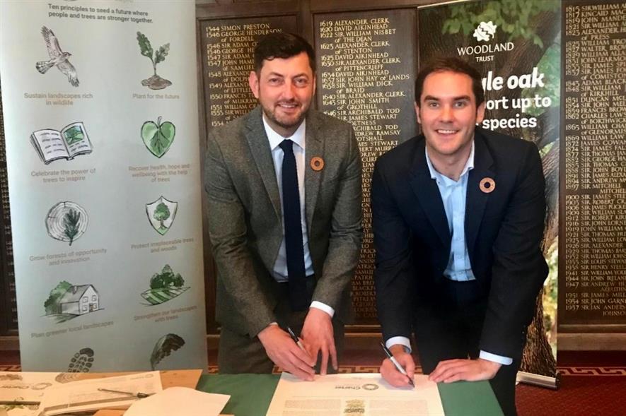 Councillors Cammy Day (left) and Adam McVey sign the Tree Charter - image: City of Edinburgh Council