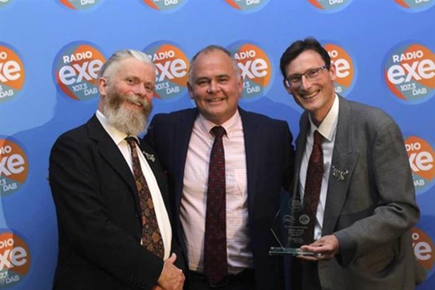 Jon Freeman (left) and Simon Bates (right) of Clyst Great Trees receive the award from Richard Marsh of sponsor Coastal Recycling - image: East Devon District Council