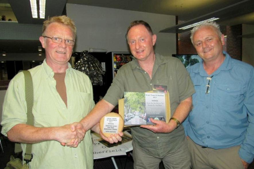 Robin Ridley (left) receives an award from Professor Ian Rotherham, at the event organised by Rob McBride (right) - Image: The Tree Hunter