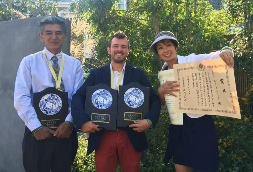 Paul Hervey-Brookes (centre) shows off his three awards. Picture: Andrew Fisher-Tomlin