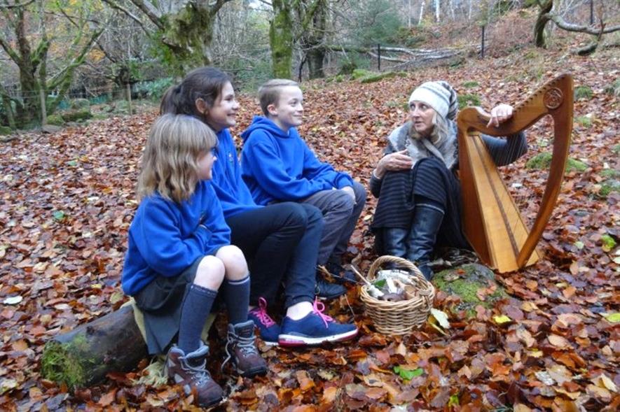 Pupils from Invergarry Primary School with singer and harpist Claire Hewitt - image: Trees for Life