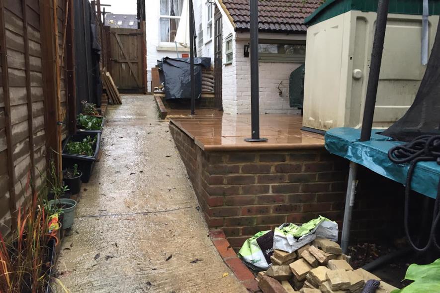 The half finished patio in the family garden - credit: Conquest Landscapes