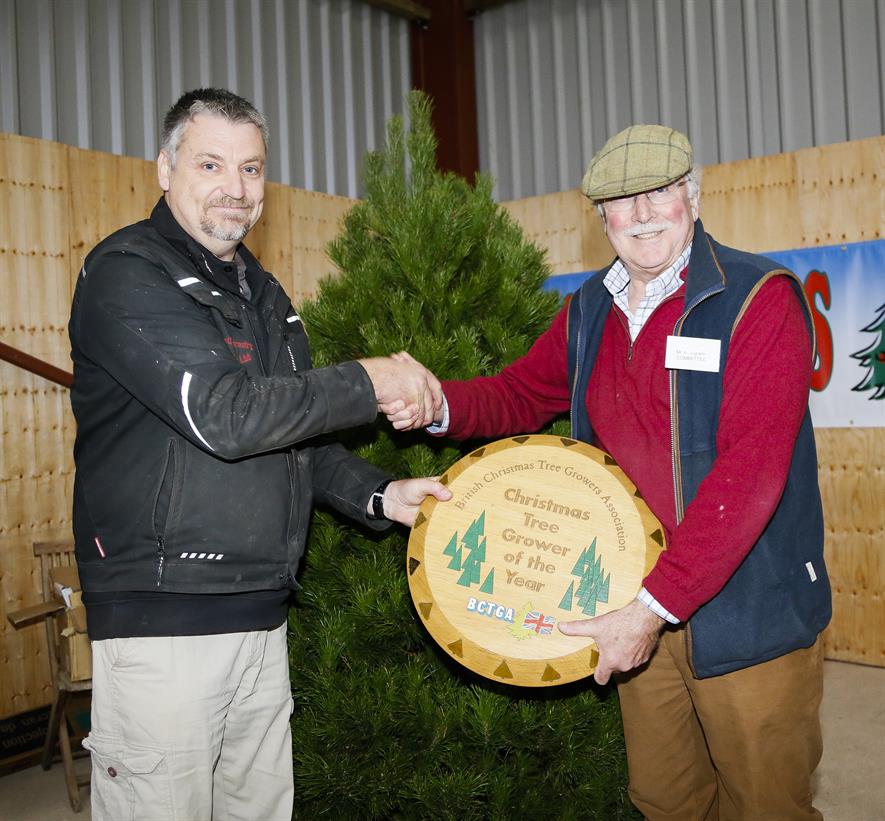 Dave Brown, BCTGA committee member (Festive Forestry), presents Andrew Ingram with the Champion Tree Grower award