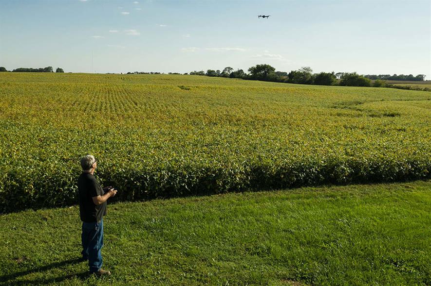American soy bean farmer using a drone to survey his crop