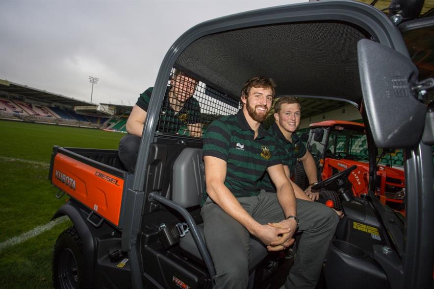 Northampton Saints players in a new Kubota machine. Image: Kubota UK