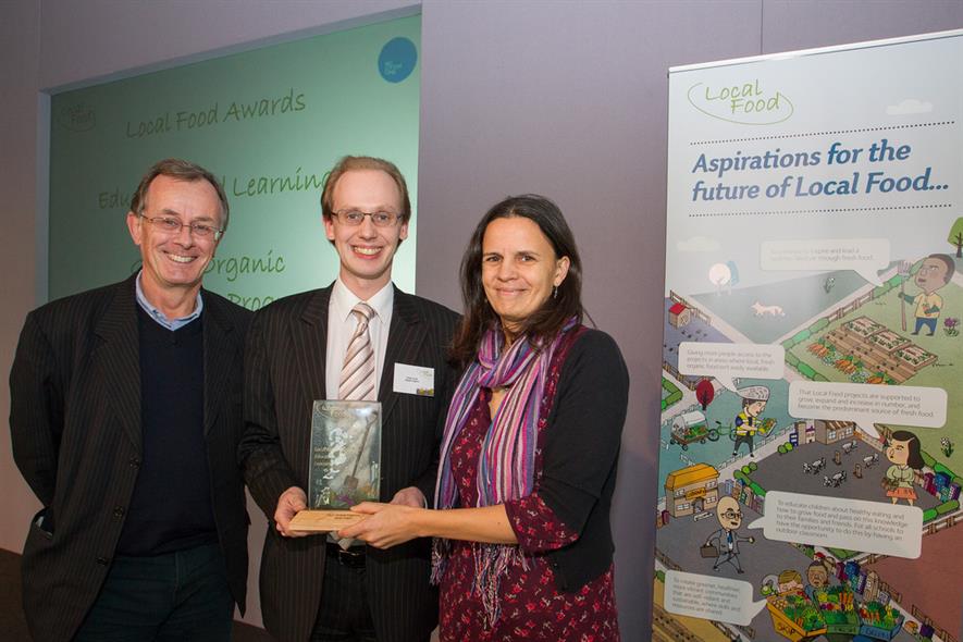 Master Gardener Philip Turvil (centre) accepts Local Food award