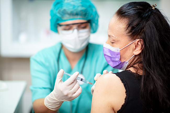 Flu vaccination during the pandemic (Picture: zoranm/Getty Images)