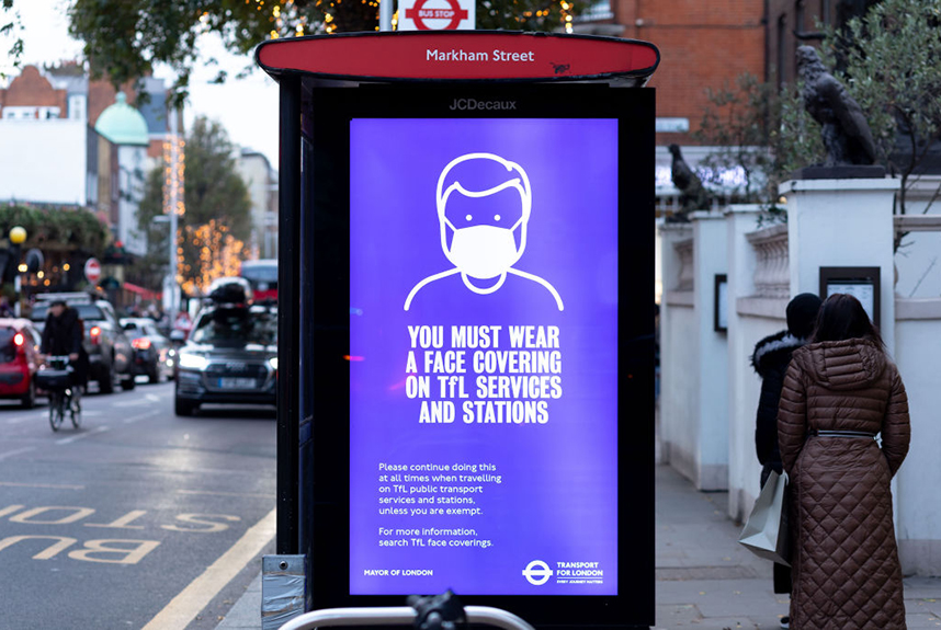 Poster advising facemasks musy be worn on public transport in London