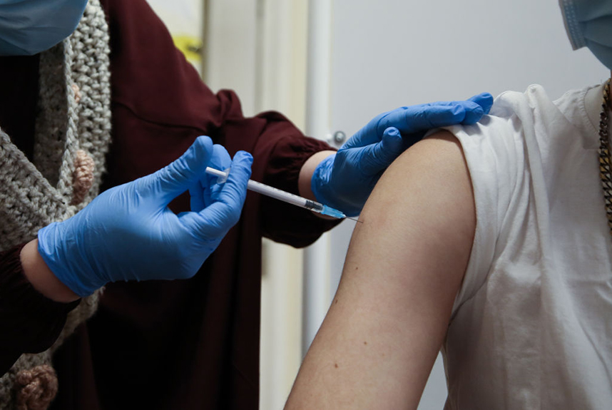 Close up of a person receiving the COVID-19 booster vaccine