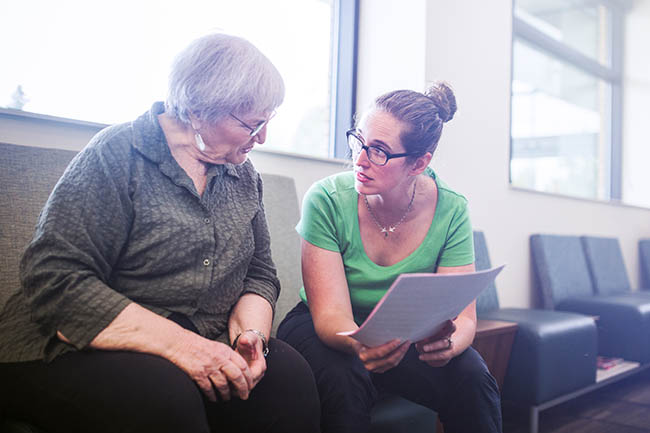 A social prescriber discussing care with a patient