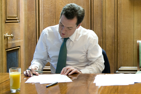Balancing act: George Osborne works on his Budget speech (Credit: Rex Features)
