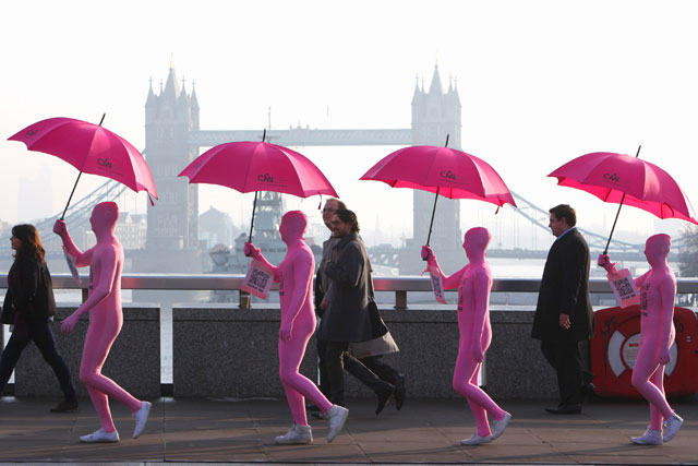 In the pink: commuters get a helping hand from the CMI's pink Shadowmen