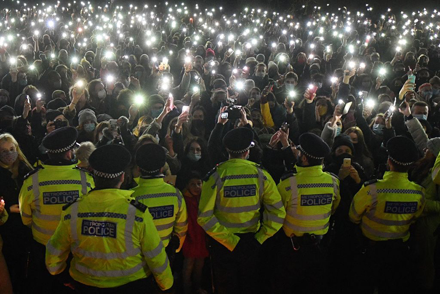 Police form a containment line at a vigil for Sarah Everard at Clapham Common on Saturday night (Photo: Getty Images)