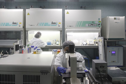 Novartis: technicians work on the 4CmenB vaccine