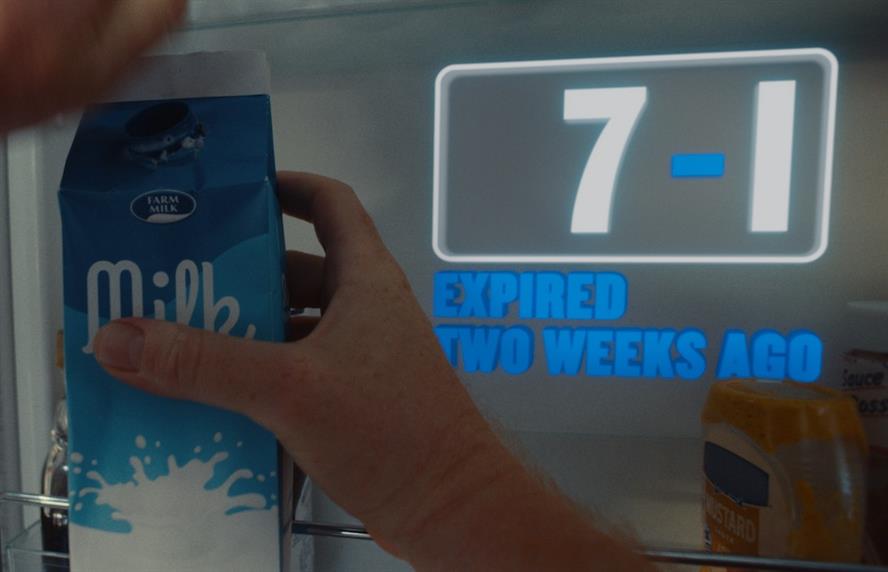 Person holding milk carton with words "expired two weeks ago" superimposed in background