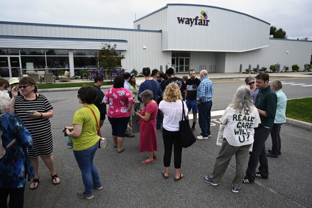 Employees, supporters and journalists gather as workers walked out of work at Wayfair in Brunswick. (Shawn Patrick Ouellette/Portland Press Herald via Getty Images)