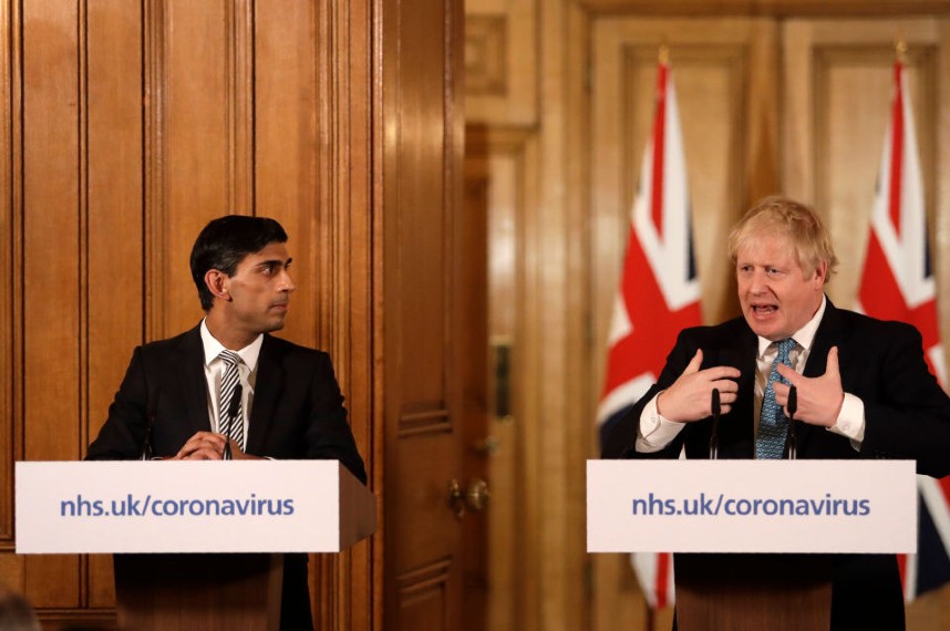 Sunak and Johnson display markedly different styles at the daily press briefings (Pic credit: Getty Images)