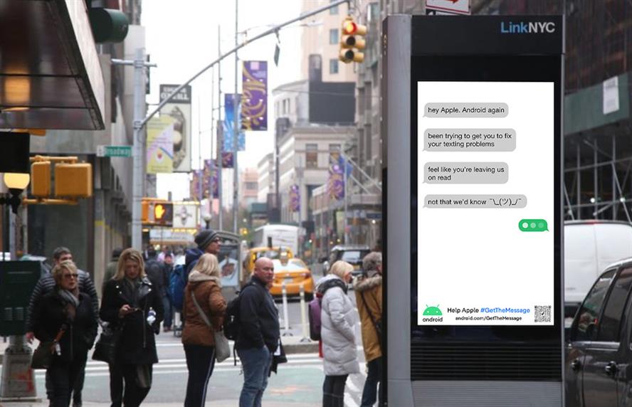 Billboard displaying Android ad showing text chats with gray and green text bubbles