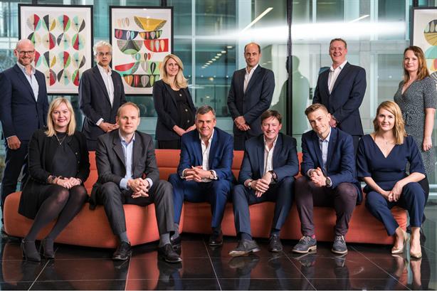 Hanover's executive committee with CEO Charles Lewington (front row, third from left) and Avenir Global’s Ralph Sutton (front row, third from right). Pic credit: Paolo Ferla