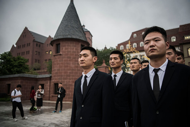 Huawei security guards at its Shenzhen headquarters in China. (Photo by Kevin Frayer/Getty Images)