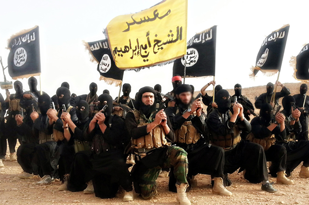 Isis fighters pose in a propaganda photo released by the organisation (pic credit: Handout / Alamy Stock Photo)