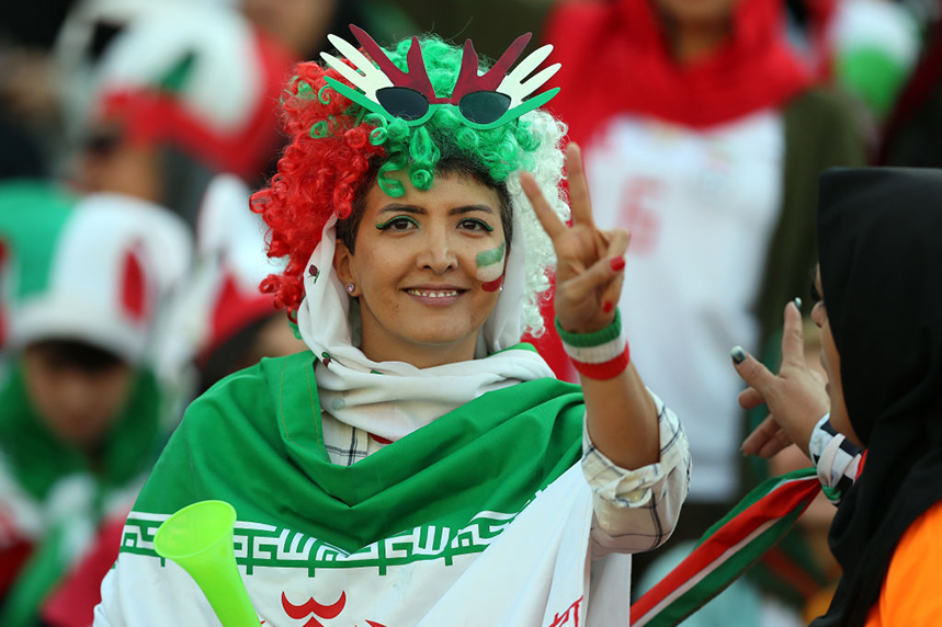 An Iranian fan attends a live football match for the first time. (Photos by Amin M. Jamali/Getty Images)