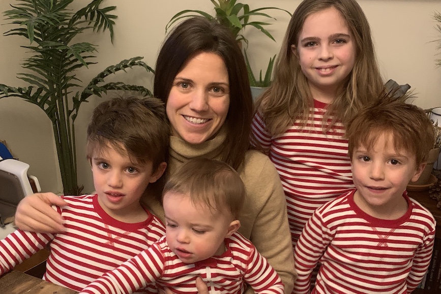Zeno's Jackie Cox Battles at her work station (aka kitchen table) with 10-year-old stepdaughter Avery, 5-year-old twins Olney and Marty and 17-month-old Henry.