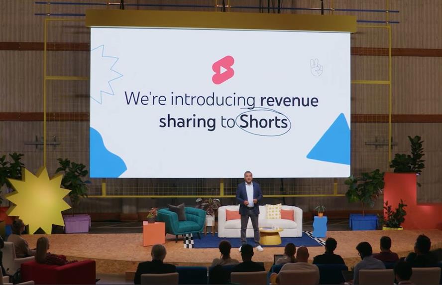 Stage with screen displaying YouTube Shorts powerpoint slides