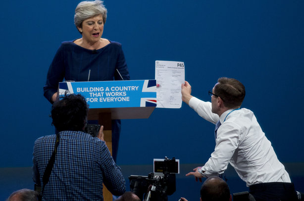 Theresa May is handed her P45 (pic credit: DAVID HARTLEY/REX/Shutterstock)