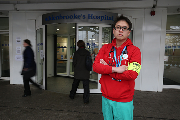 Dr Anthony Ng on the picket line outside Addenbrooke's Hospital in Cambridge in March (© Chris Radburn/PA Wire)