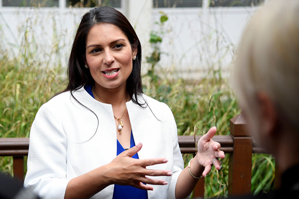 Priti Patel believes the police shouldn't 'waste' resources on social media comms salaries. (Photo: Toby Melville/Getty Images)