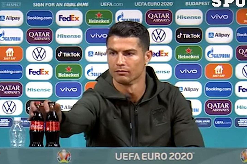 Cristiano Ronaldo moves two bottles of Coca-Cola at a Euro 2020 press conference